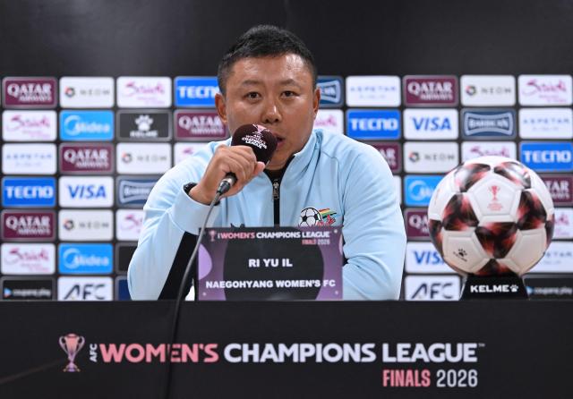 North Korea's Naegohyang Women's FC head coach Ri Yu Il speaks during a press conference at Suwon Sports Complex in Suwon on May 19, 2026, ahead of the Women's Asian Champions League semi-final football match against South Korea's Suwon FC Women. (Photo by JUNG YEON-JE / POOL / AFP)
