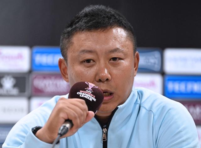 North Korea's Naegohyang Women's FC head coach Ri Yu Il speaks during a press conference at Suwon Sports Complex in Suwon on May 19, 2026, ahead of the Women's Asian Champions League semi-final football match against South Korea's Suwon FC Women. (Photo by JUNG YEON-JE / POOL / AFP)