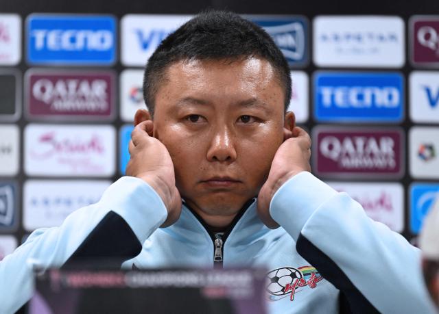 North Korea's Naegohyang Women's FC head coach Ri Yu Il reacts during a press conference at Suwon Sports Complex in Suwon on May 19, 2026, ahead of the Women's Asian Champions League semi-final football match against South Korea's Suwon FC Women. (Photo by JUNG YEON-JE / POOL / AFP)