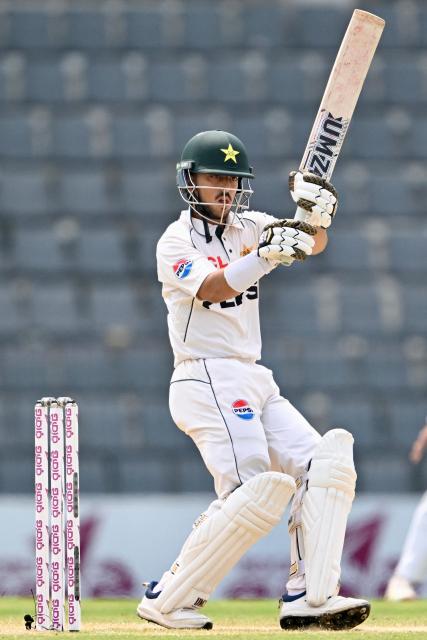 Pakistan’s Azan Awais plays a shot during the fourth day of the second Test cricket match between Bangladesh and Pakistan at the Sylhet International Cricket Stadium in Sylhet on May 19, 2026. (Photo by MUNIR UZ ZAMAN / AFP)