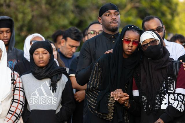 Community members gather at a vigil for victims and families of a shooting at the Islamic Center of San Diego, California, on May 19, 2026, a day after the attack. A shooting at a mosque complex in California on May 18, 2026 killed three people, with two suspected teenage gunmen later found dead in a car from self-inflicted gunshot wounds, police said. (Photo by Zoë Meyers / AFP)