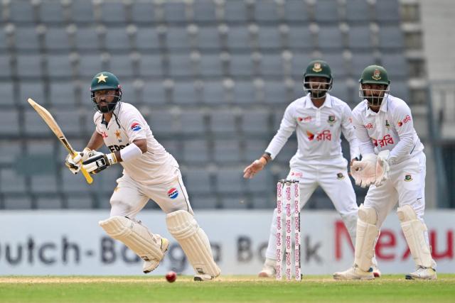 Pakistan’s Sajid Khan (L) plays a shot during the fifth day of the second Test cricket match between Bangladesh and Pakistan at the Sylhet International Cricket Stadium in Sylhet on May 20, 2026. (Photo by MUNIR UZ ZAMAN / AFP)