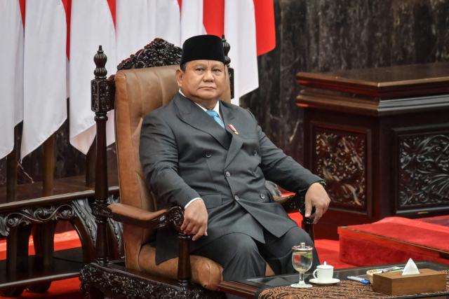 Indonesian President Prabowo Subianto looks on before delivering a speech on the macroeconomic framework to lawmakers at the Parliament building in Jakarta on May 20, 2026. (Photo by BAY ISMOYO / AFP)