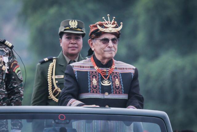 East Timor President Jose Ramos-Horta (R) reviews the troops during a military parade marking the 24th anniversary of the Restoration of Independence in Tasitolu, Dili, on May 20, 2026. (Photo by VALENTINO DARIELL DE SOUSA / AFP)