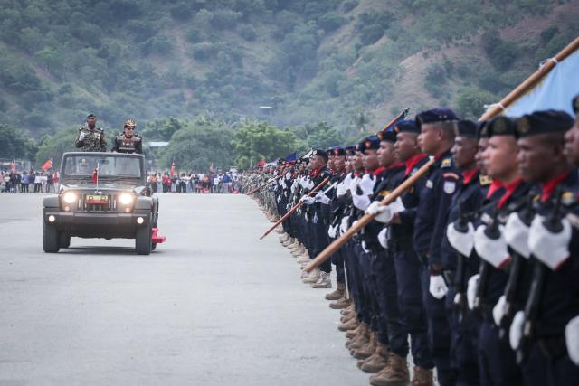 East Timor President Jose Ramos-Horta (R) reviews the troops during a military parade marking the 24th anniversary of the Restoration of Independence in Tasitolu, Dili, on May 20, 2026. (Photo by VALENTINO DARIELL DE SOUSA / AFP)