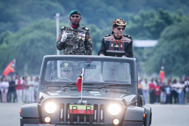 East Timor President Jose Ramos-Horta (R) reviews the troops during a military parade marking the 24th anniversary of the Restoration of Independence in Tasitolu, Dili, on May 20, 2026. (Photo by VALENTINO DARIELL DE SOUSA / AFP)