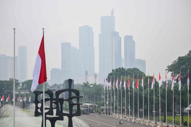 Skyscrapers are seen shrouded in haze in Jakarta on May 20, 2026. (Photo by BAY ISMOYO / AFP)