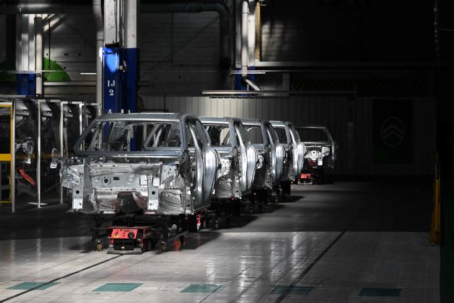 (FILES) This photograph shows chassis of the new Citroen C5 Aircross on a production line of the Stellantis car maker plant in Chartres-de-Bretagne, near Rennes, western France, on July 3, 2025. Jeep and Fiat owner Stellantis said on May 20, 2026, it had formed a joint venture with China's Dongfeng to share manufacturing, sales and engineering operations in Europe. (Photo by Damien MEYER / AFP)