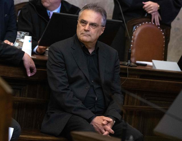 Austrian former intelligence official Egisto Ott has taken his seat to attend a session of his trial at the criminal court in Vienna, Austria, where the verdict was expected on May 20, 2026. Ott is currently standing trial on a slew of charges that include handing over sensitive devices and selling secret information to Russia. Ott, who denies all the charges against him, is also accused of having passed secret information for years to Jan Marsalek, the former chief operating officer of Germany's collapsed payment processing firm Wirecard, who is suspected of working for Russia's intelligence services. (Photo by Joe Klamar / AFP)