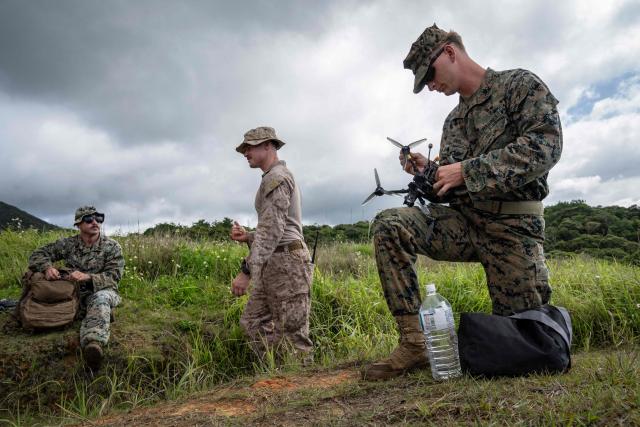 TOPSHOT - US Marines take part in a drone operator training course at the Camp Schwab in Nago, Okinawa prefecture on May 20, 2026. (Photo by Yuichi YAMAZAKI / AFP)
