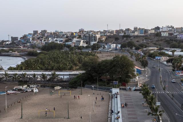 A general view of people playing football at Gamboa Beach in Praia, on May 19, 2026. (Photo by PATRICK MEINHARDT / AFP)