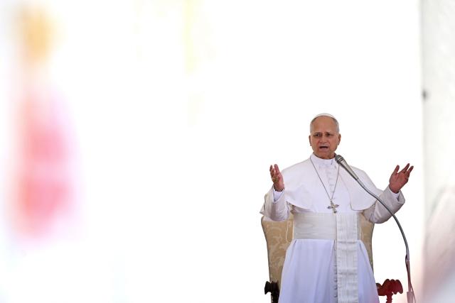 Pope Leo XIV gestures as he addresses the crowd during the weekly general audience at St Peter's Square in the Vatican on May 20, 2026. (Photo by TIZIANA FABI / AFP)