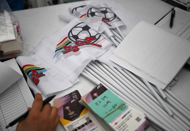 Flags of North Korea's Naegohyang Women's FC and tickets are seen on a desk at a ticket booth for the AFC Women's Champions League semi-final football match between North Korea's Naegohyang Women's FC and South Korea's Suwon FC Women in Suwon on May 20, 2026. (Photo by Jung Yeon-je / AFP)