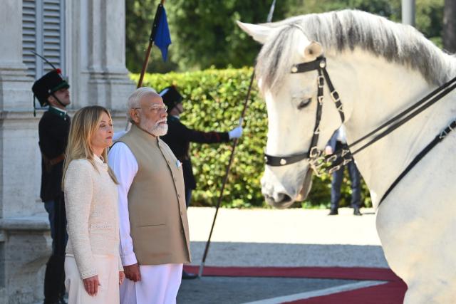Italy’s Prime Minister Giorgia Meloni welcomes her counterpart India’s Narendra Modi for a meeting at Villa Doria Pamphili in Rome on May 20, 2026. (Photo by Alberto PIZZOLI / AFP)