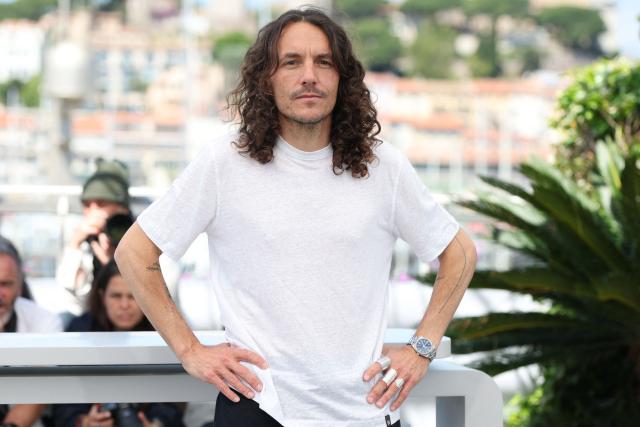 French director, writer and producer Christophe Dimitri Reveille poses during a photocall of the film "Les Survivants du Che" at the 79th edition of the Cannes Film Festival in Cannes, southern France on May 20, 2026. (Photo by Sameer AL-DOUMY / AFP)