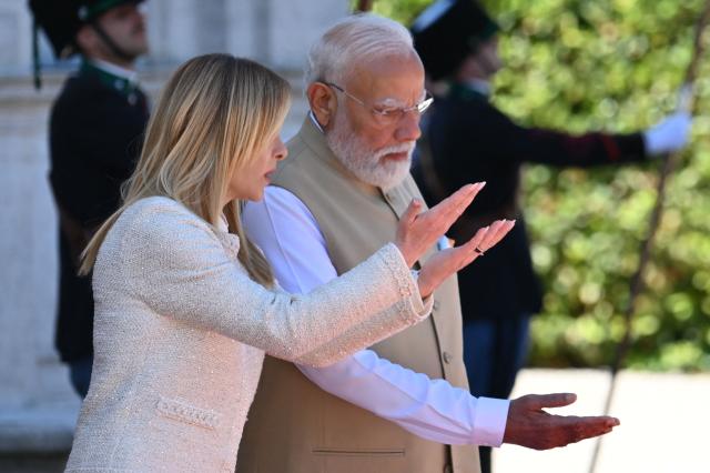 Italy’s Prime Minister Giorgia Meloni welcomes her counterpart India’s Narendra Modi for a meeting at Villa Doria Pamphili in Rome on May 20, 2026. (Photo by Alberto PIZZOLI / AFP)