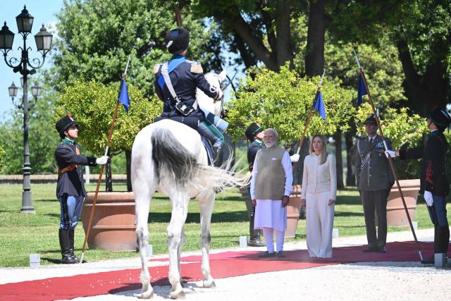Italy’s Prime Minister Giorgia Meloni welcomes her counterpart India’s Prime Minister Narendra Modi for a meeting at Villa Doria Pamphili in Rome on May 20, 2026. (Photo by Alberto PIZZOLI / AFP)