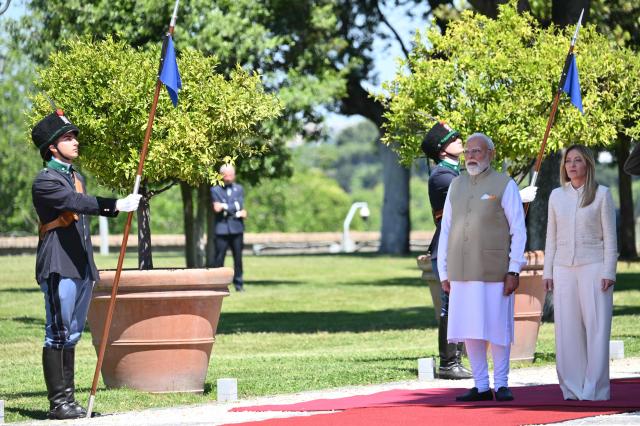 Italy’s Prime Minister Giorgia Meloni welcomes her counterpart India’s Prime Minister Narendra Modi for a meeting at Villa Doria Pamphili in Rome on May 20, 2026. (Photo by Alberto PIZZOLI / AFP)