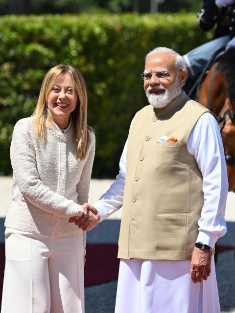 Italy’s Prime Minister Giorgia Meloni welcomes her counterpart India’s Prime Minister Narendra Modi for a meeting at Villa Doria Pamphili in Rome on May 20, 2026. (Photo by Alberto PIZZOLI / AFP)