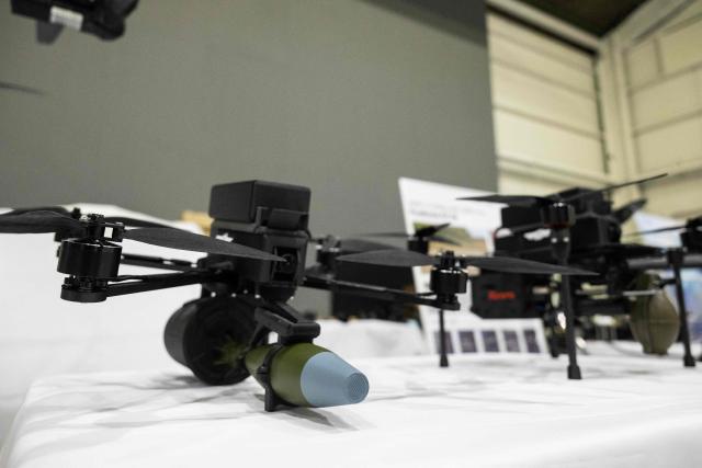 Armed drone models are seen at the Prodrone research facility in Nagoya on May 20, 2026, as Japan pushes to expand military drone capabilities with nearly USD 850 million earmarked for unmanned defense systems in its 2026 defense budget. (Photo by ANDREW CABALLERO-REYNOLDS / AFP)