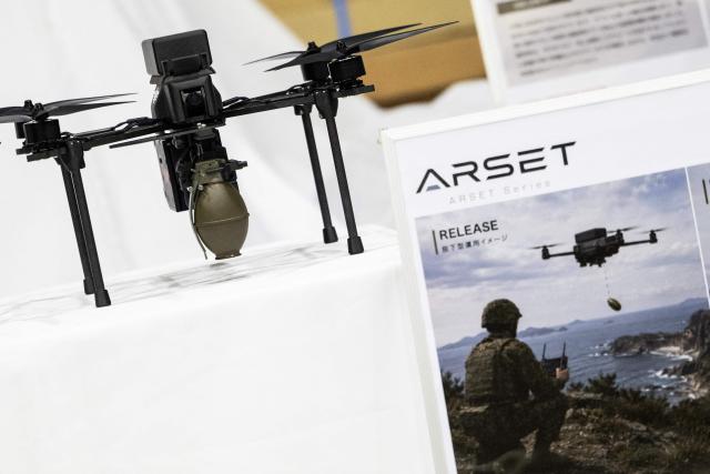Armed drone models are seen at the Prodrone research facility in Nagoya on May 20, 2026, as Japan pushes to expand military drone capabilities with nearly USD 850 million earmarked for unmanned defense systems in its 2026 defense budget. (Photo by ANDREW CABALLERO-REYNOLDS / AFP)