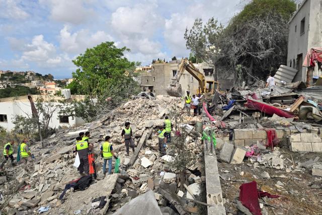 Lebanese civil defence workers search through the rubble in the southern Lebanese village of Deir Qanun al-Nahr on May 20, 2026, a day after Israeli strikes. Israeli strikes on south Lebanon killed 19 people, the health ministry said, as Hezbollah reported clashes with Israeli troops despite a truce in the war. Hezbollah drew Lebanon into the Middle East war on March 2 by firing rockets at Israel in support of its backer Iran. Since the start of the ceasefire on April 17, Israel has continued to launch strikes, carry out demolitions and issue evacuation orders in south Lebanon, saying it is targeting Hezbollah. (Photo by KAWNAT HAJU / AFP)