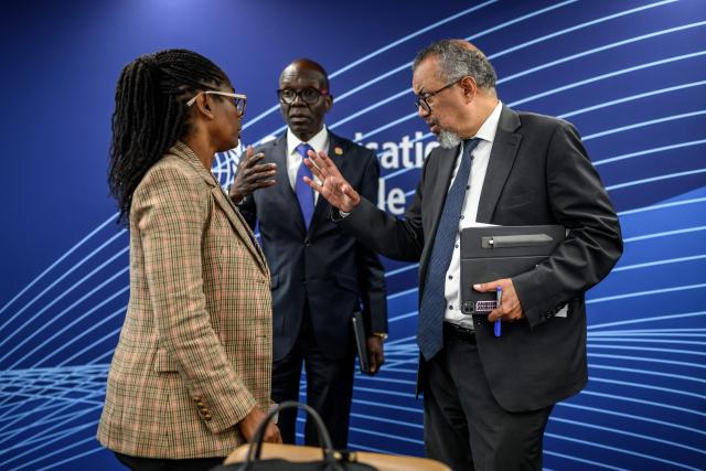 (From L) World Health Organization (WHO) director and incident manager Marie Roseline Belizaire, WHO regional director for Africa Mohamed Yakub Janabi and WHO Director-General Tedros Adhanom Ghebreyesus speak together after a press conference on Ebola outbreak in Democratic Republic of Congo and Uganda, in Geneva, on May 20, 2026. The spread of Ebola in the Democratic Republic of Congo means the outbreak likely began a few months ago, the WHO said on May 20, 2026. (Photo by Fabrice COFFRINI / AFP)