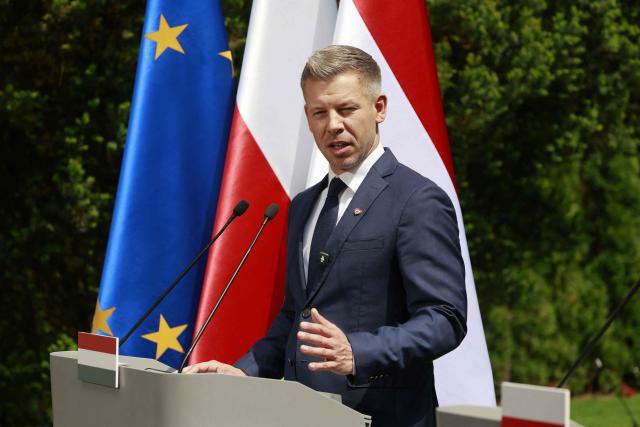Hungary's Prime Minister Peter Magyar speaks during a joint press conference with Poland's Prime Minister at the garden of the Prime Minister's residency in Warsaw, Poland, on May 20, 2026. Hungary's new Prime Minister Peter Magyar is on a two-day visit to Poland for his first official trip abroad, hoping to mark his country's re-alignment with the European Union after years of open conflict under his predecessor. (Photo by Wojtek RADWANSKI / AFP)