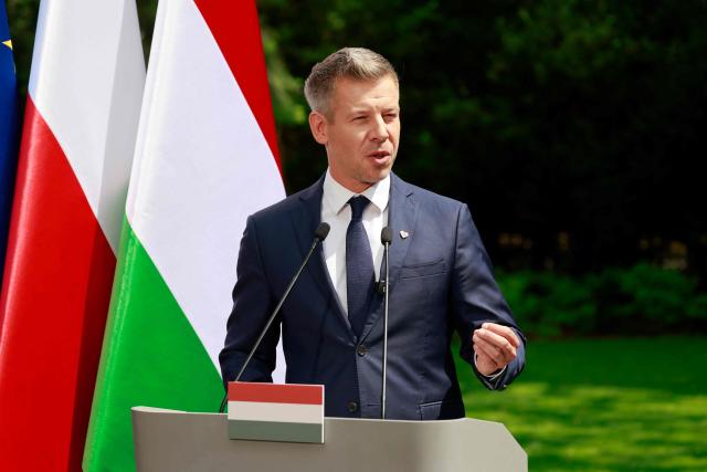 Hungary's Prime Minister Peter Magyar gestures during a joint press conference with Poland's Prime Minister at the garden of the Prime Minister's residency in Warsaw, Poland, on May 20, 2026. Hungary's new Prime Minister Peter Magyar is on a two-day visit to Poland for his first official trip abroad, hoping to mark his country's re-alignment with the European Union after years of open conflict under his predecessor. (Photo by Wojtek RADWANSKI / AFP)