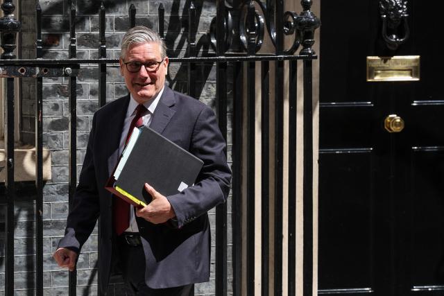 Britain's Prime Minister Keir Starmer leaves 10 Downing Street in central London on May 20, 2026, to take part in the weekly session of 'Prime Minister's Questions' (PMQs). (Photo by Adrian DENNIS / AFP)