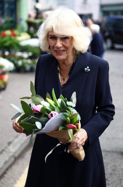 Britain's Queen Camilla meets well-wishers after visiting the village’s oldest shop in Hillsborough, Northern Ireland on May 20, 2026, on the second day of a three-day royal visit to Northern Ireland. (Photo by Henry Nicholls / POOL / AFP)