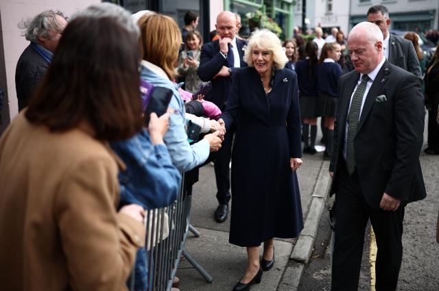 Britain's Queen Camilla meets well-wishers after visiting the village’s oldest shop in Hillsborough, Northern Ireland on May 20, 2026, on the second day of a three-day royal visit to Northern Ireland. (Photo by Henry Nicholls / POOL / AFP)