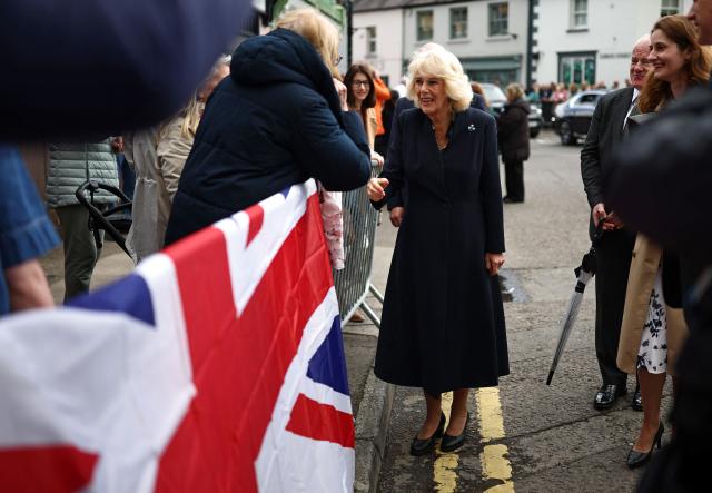 Britain's Queen Camilla meets well-wishers after visiting the village’s oldest shop in Hillsborough, Northern Ireland on May 20, 2026, on the second day of a three-day royal visit to Northern Ireland. (Photo by Henry Nicholls / POOL / AFP)