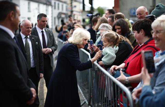 Britain's Queen Camilla meets well-wishers after visiting the village’s oldest shop in Hillsborough, Northern Ireland on May 20, 2026, on the second day of a three-day royal visit to Northern Ireland. (Photo by Henry Nicholls / POOL / AFP)