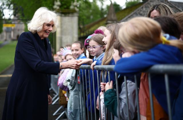 Britain's Queen Camilla meets meets schoolchildren in Hillsborough, Northern Ireland on May 20, 2026, on the second day of a three-day royal visit to Northern Ireland. (Photo by Henry Nicholls / POOL / AFP)
