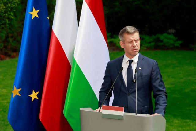 Hungary's Prime Minister Peter Magyar looks left during a joint press conference with Poland's Prime Minister at the garden of the Prime Minister's residency in Warsaw, Poland, on May 20, 2026. Hungary's new Prime Minister Peter Magyar is on a two-day visit to Poland for his first official trip abroad, hoping to mark his country's re-alignment with the European Union after years of open conflict under his predecessor. (Photo by Wojtek RADWANSKI / AFP)