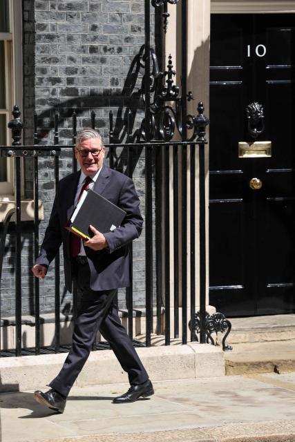 Britain's Prime Minister Keir Starmer leaves 10 Downing Street in central London on May 20, 2026, to take part in the weekly session of 'Prime Minister's Questions' (PMQs). (Photo by Adrian DENNIS / AFP)