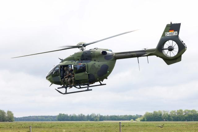 A Helicopter H145M of the German Army Bundeswehr performs for the media during the Defence Summit 2026 at Airbus Defence and Space GmbH in Manching, Bavaria, southern Germany, on May 20, 2026. (Photo by Michaela STACHE / AFP)