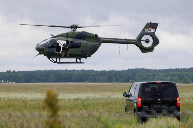 A Helicopter H145M of the German Army Bundeswehr and soldiers perform for the media during the Defence Summit 2026 at Airbus Defence and Space GmbH in Manching, Bavaria, southern Germany, on May 20, 2026. (Photo by Michaela STACHE / AFP)