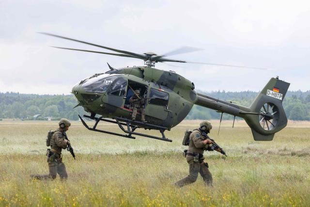A Helicopter H145M of the German Army Bundeswehr and soldiers perform for the media during the Defence Summit 2026 at Airbus Defence and Space GmbH in Manching, Bavaria, southern Germany, on May 20, 2026. (Photo by Michaela STACHE / AFP)