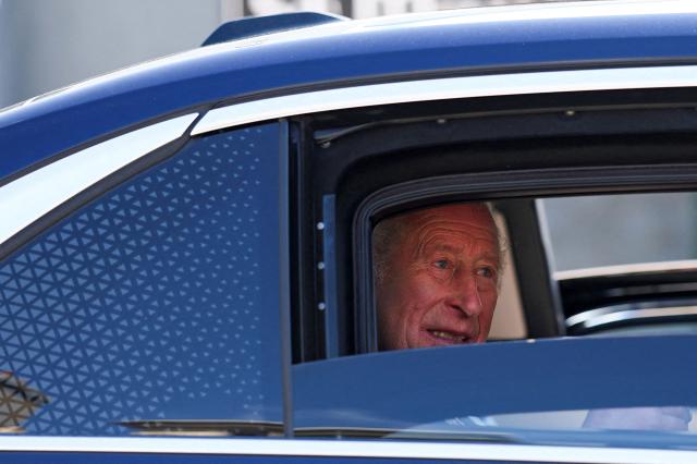 Britain's King Charles III waves as he is driven away in a car after a visit to Donard Methodist Church in Newcastle, south of Belfast, Northern Ireland on May 20, 2026, on the second day of a three-day royal visit to Northern Ireland. (Photo by Toby Melville / POOL / AFP)