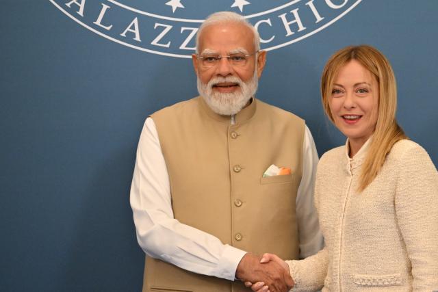 India's Prime Minister Narendra Modi and Italy’s Prime Minister Giorgia Meloni pose at the end of a press conference at Villa Doria Pamphili in Rome on May 20, 2026. (Photo by Alberto PIZZOLI / AFP)