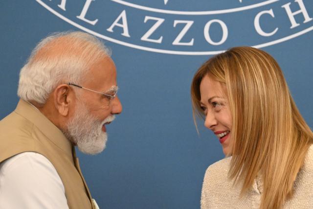 India's Prime Minister Narendra Modi and Italy’s Prime Minister Giorgia Meloni greet each other at the end of a press conference at Villa Doria Pamphili in Rome on May 20, 2026. (Photo by Alberto PIZZOLI / AFP)