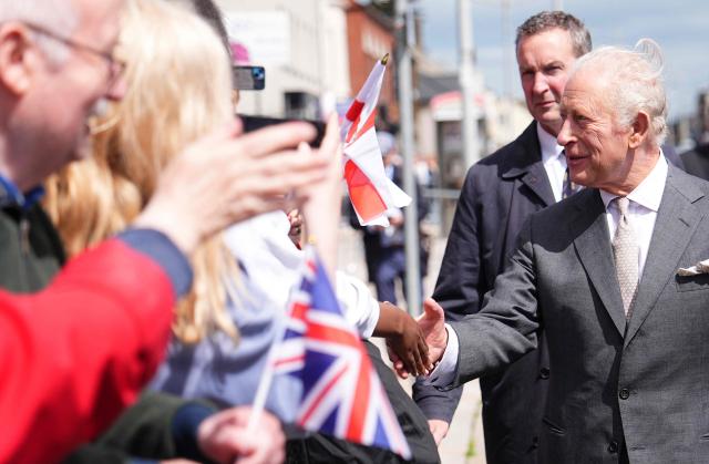 Britain's King Charles III greets well-wishers after a visit to the Pantry Foodbank at the Donard Methodist Church in Newcastle, south of Belfast, Northern Ireland on May 20, 2026, on the second day of a three-day royal visit to Northern Ireland. (Photo by Aaron Chown / POOL / AFP)