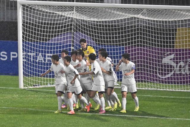 North Korea's Naegohyang Women's FC players celebrate after scoring against South Korea's Suwon FC Women during the Women's Asian Champions League semi-final at Suwon Sports Complex in Suwon on May 20, 2026. (Photo by Pedro Pardo / AFP)