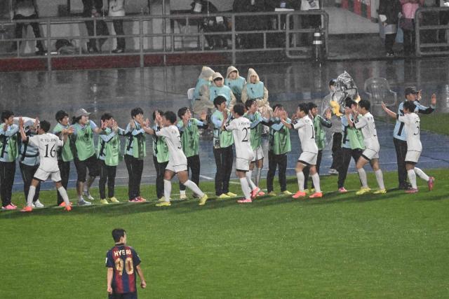 North Korea's Naegohyang Women's FC players (white) celebrate after scoring against South Korea's Suwon FC Women during the Women's Asian Champions League semi-final at Suwon Sports Complex in Suwon on May 20, 2026. (Photo by Pedro Pardo / AFP)