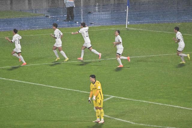 North Korea's Naegohyang Women's FC players celebrate after scoring against South Korea's Suwon FC Women during the Women's Asian Champions League semi-final at Suwon Sports Complex in Suwon on May 20, 2026. (Photo by Pedro Pardo / AFP)