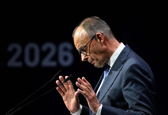 German Chancellor Friedrich Merz gestures as he addresses guests to open a so-called eSummit organised by the ZVEI Association of the German electro and digital industry, in Berlin on May 20, 2026. (Photo by Tobias SCHWARZ / AFP)