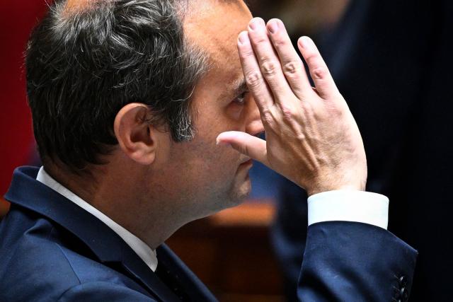 France's Prime Minister Sebastien Lecornu gestures upon arrival to attend a session of questions to the government at The National Assembly, France's lower house of parliament in Paris on May 20, 2026. (Photo by JULIEN DE ROSA / AFP)