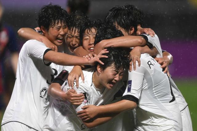 Kim Kyong Yong (C #17) of Naegohyang Women's FC celebrates scoring her team's second goal with teammates during the AFC Women's Champions League semi-final football match between North Korea's Naegohyang Women's FC and South Korea's Suwon FC Women in Suwon on May 20, 2026. (Photo by Jung Yeon-je / AFP)